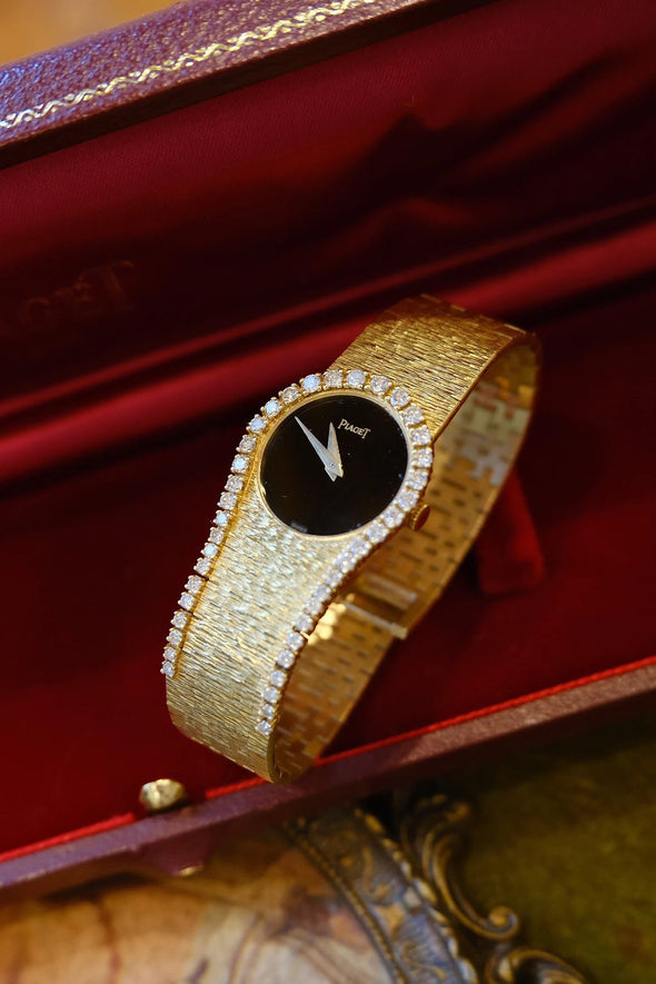 Piaget Yellow gold and diamond-set bracelet watch with onyx dial, Circa 1980