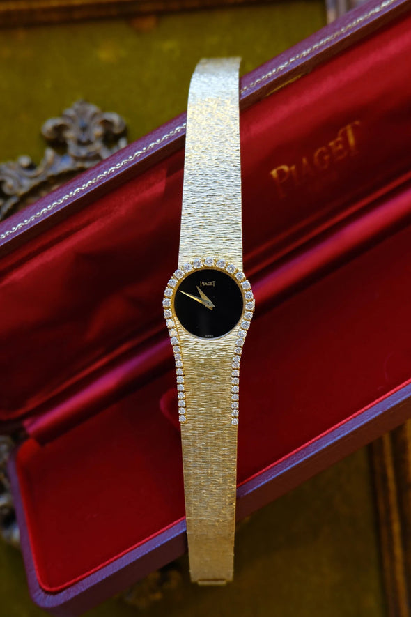 Piaget Yellow gold and diamond-set bracelet watch with onyx dial, Circa 1980