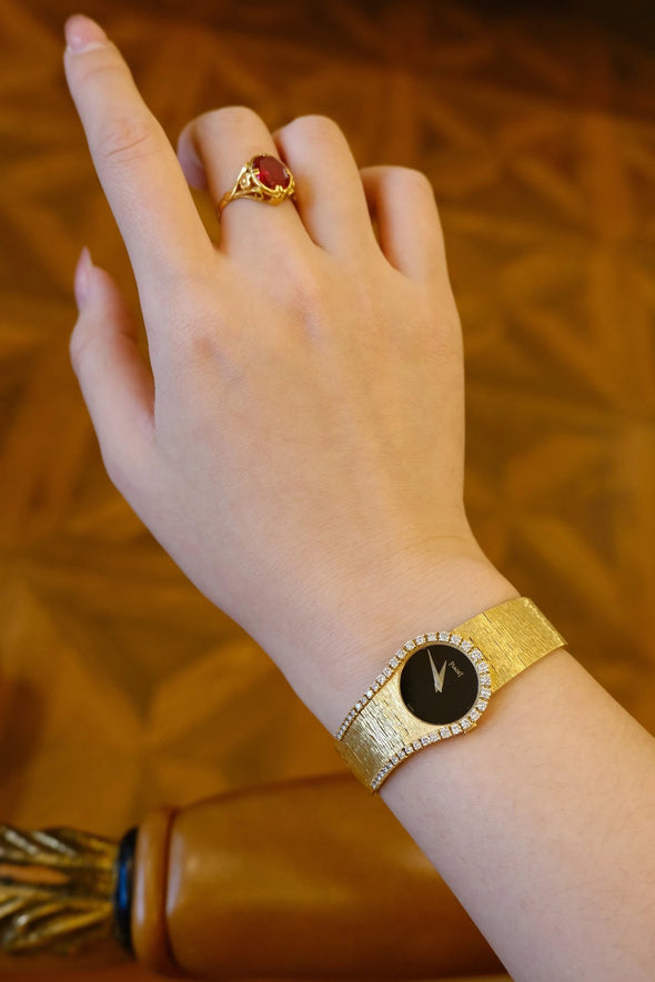 Piaget Yellow gold and diamond-set bracelet watch with onyx dial, Circa 1980