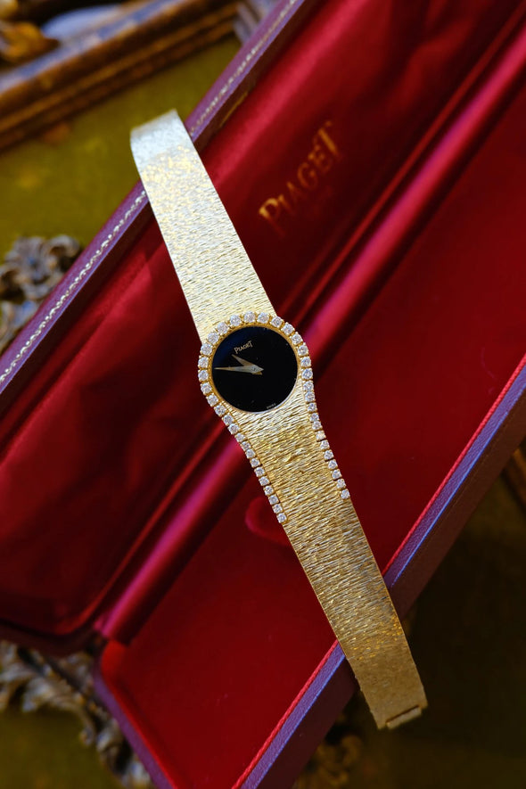 Piaget Yellow gold and diamond-set bracelet watch with onyx dial, Circa 1980
