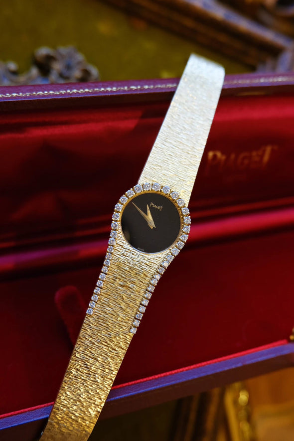 Piaget Yellow gold and diamond-set bracelet watch with onyx dial, Circa 1980