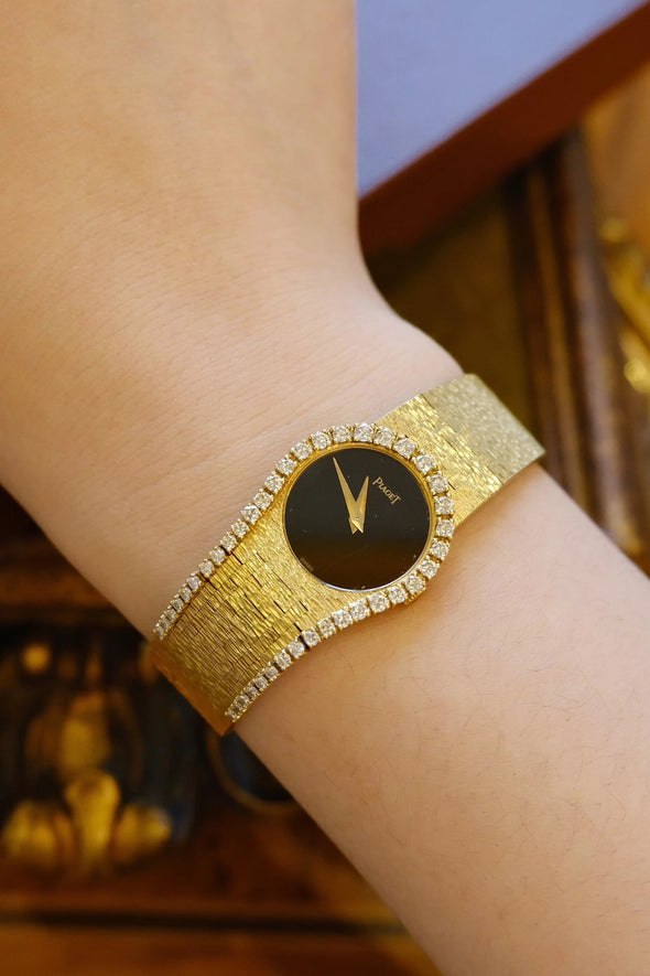Piaget Yellow gold and diamond-set bracelet watch with onyx dial, Circa 1980