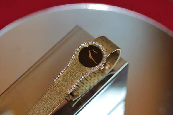 Piaget Yellow gold and diamond-set bracelet watch with onyx dial, Circa 1980