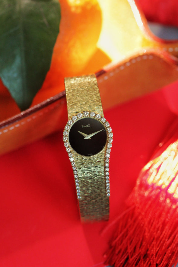 Piaget Yellow gold and diamond-set bracelet watch with onyx dial, Circa 1980